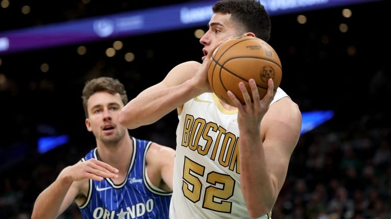 Boston Celtics forward Luka Garza (52) defends the ball from...