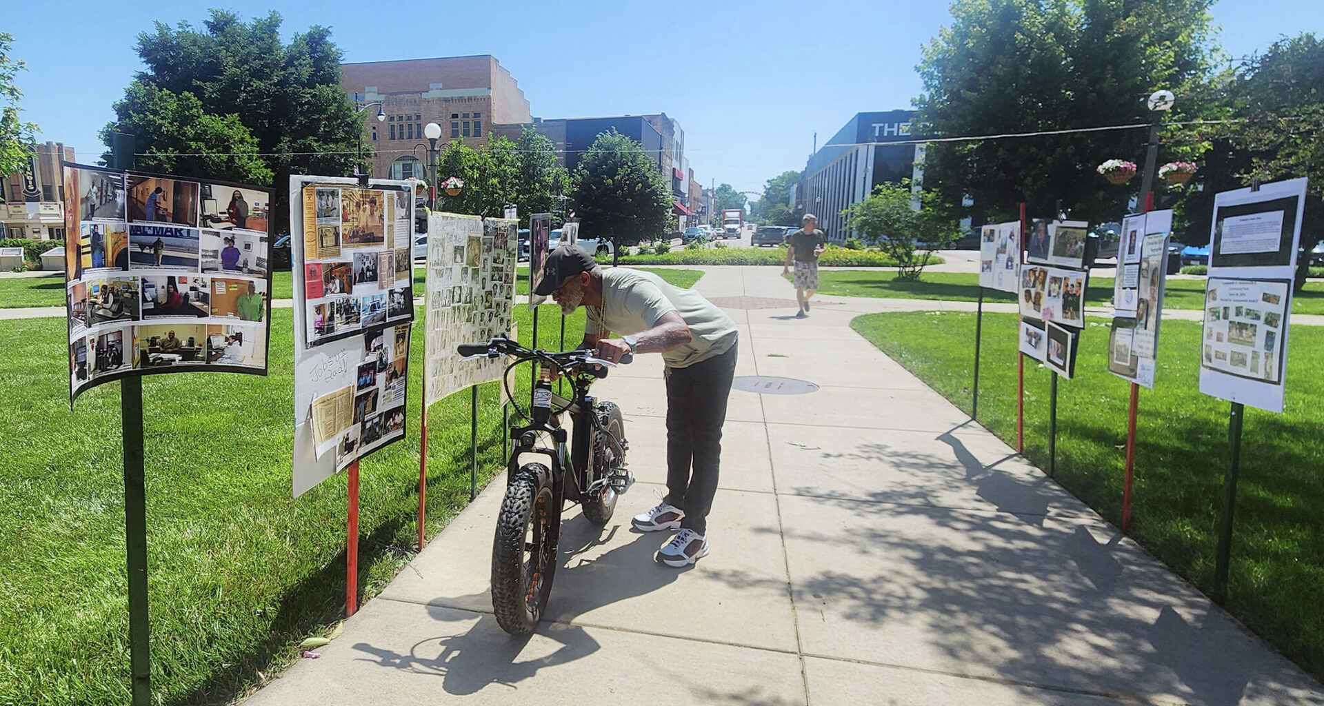 Aaron Haley of Jacksonville looks at a poster along a Jacksonville Black history trail set up as part of Juneteenth celebrations in 2025. This year's celebration will return to the square June 20.