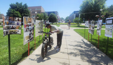Aaron Haley of Jacksonville looks at a poster along a Jacksonville Black history trail set up as part of Juneteenth celebrations in 2025. This year's celebration will return to the square June 20.