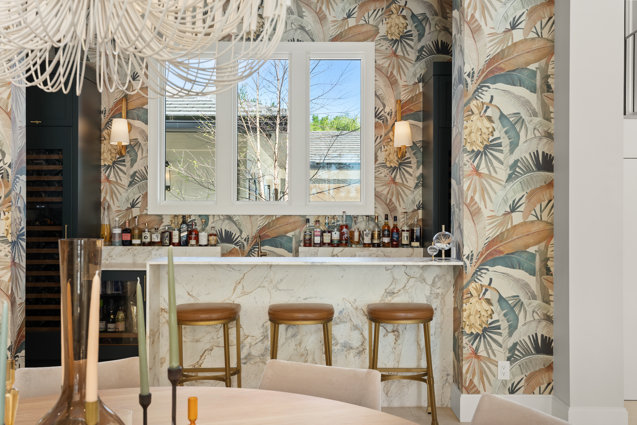 Designer wallpaper is featured throughout the home, including in this...