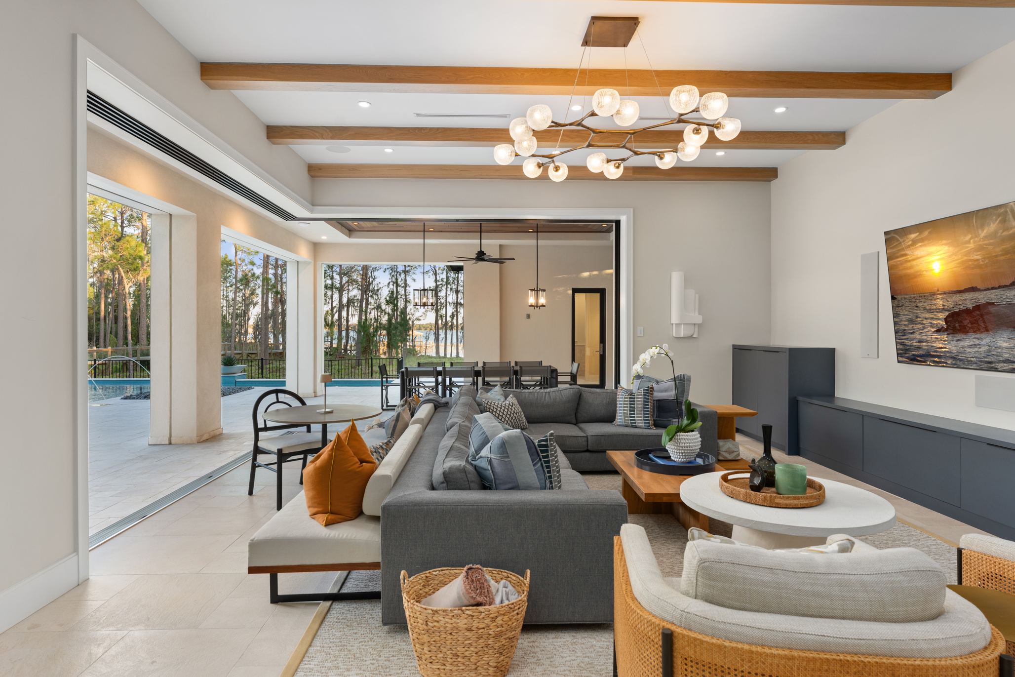 In the family room, corner pocket sliding glass doors open...