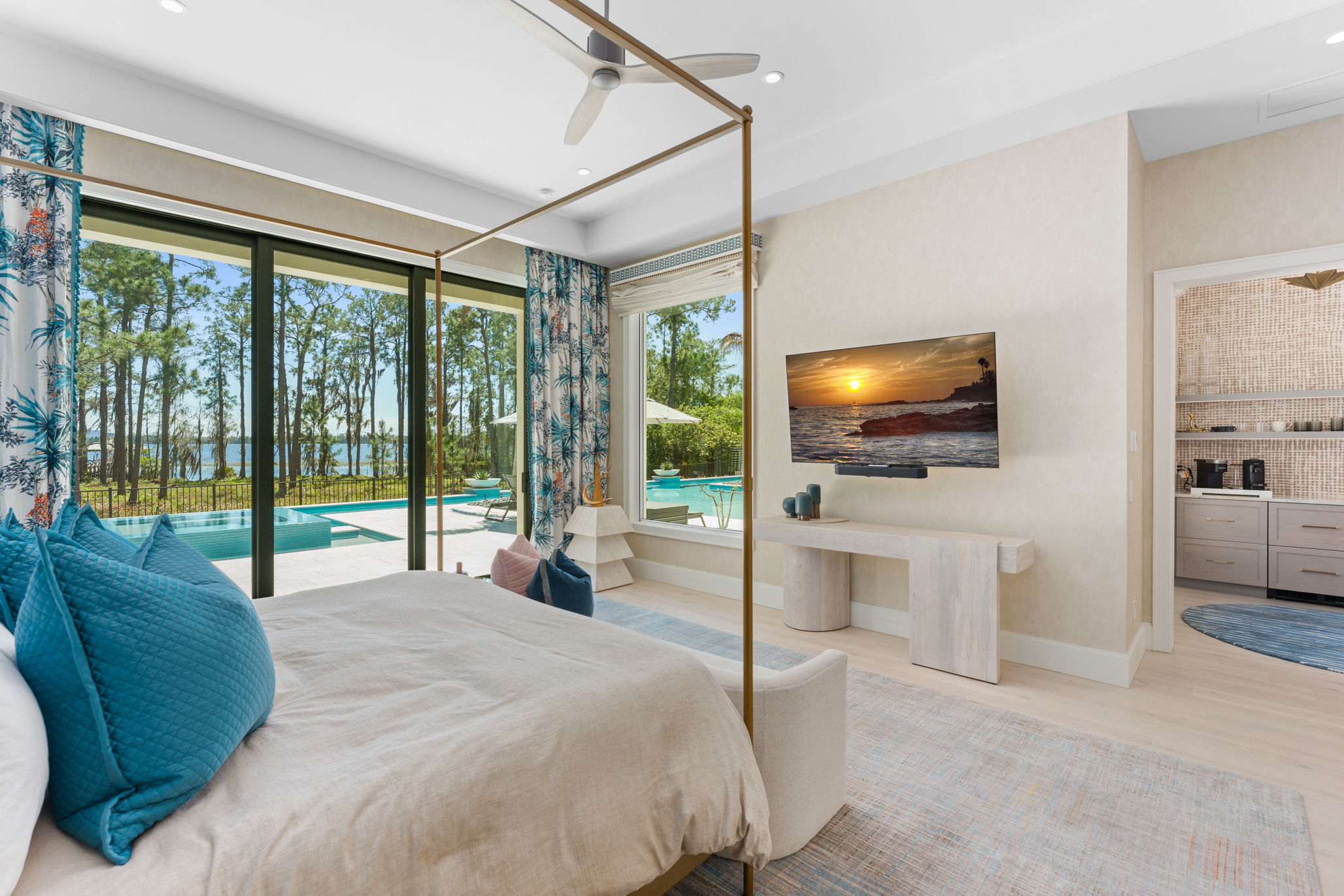 The first-floor primary suite serves as a private retreat, complete...