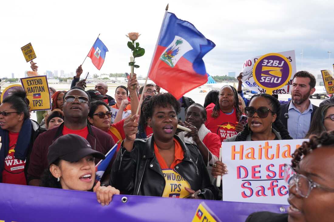 People chant during a rally in Fort Lauderdale, Fla., in support of the extension of Temporary Protected Status (TPS) for Haitian immigrants.