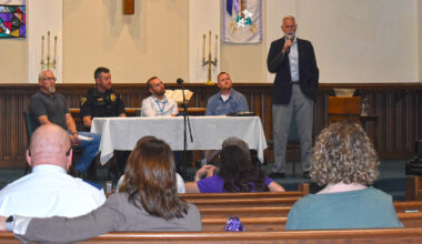 Jacksonville Alderman Joe Lockman speaks to those gathered for Jacksonville Area Conference of Church's second "Focus on Unhoused" panel at First Presbyterian Church. Lockman was one of five panelists to speak Wednesday, alongside Go Church pastor John Hutton (from left, seated behind table), Jacksonville Police Sgt. Luke Poore, Matt Lantgen of Gateway Foundation and Derek Davis of Narcotics Anonymous.