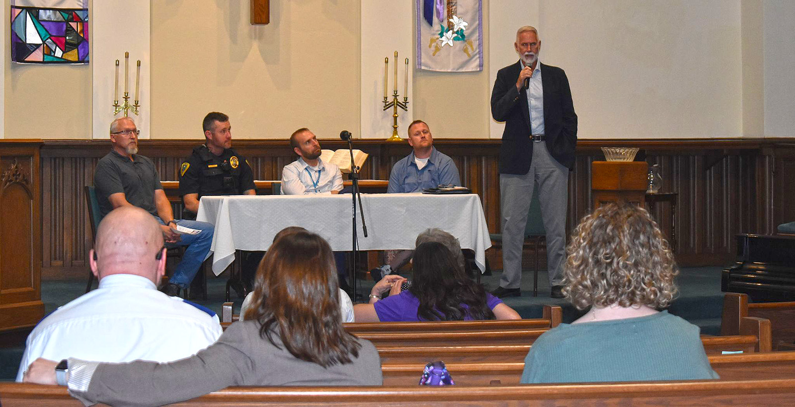 Jacksonville Alderman Joe Lockman speaks to those gathered for Jacksonville Area Conference of Church's second "Focus on Unhoused" panel at First Presbyterian Church. Lockman was one of five panelists to speak Wednesday, alongside Go Church pastor John Hutton (from left, seated behind table), Jacksonville Police Sgt. Luke Poore, Matt Lantgen of Gateway Foundation and Derek Davis of Narcotics Anonymous.