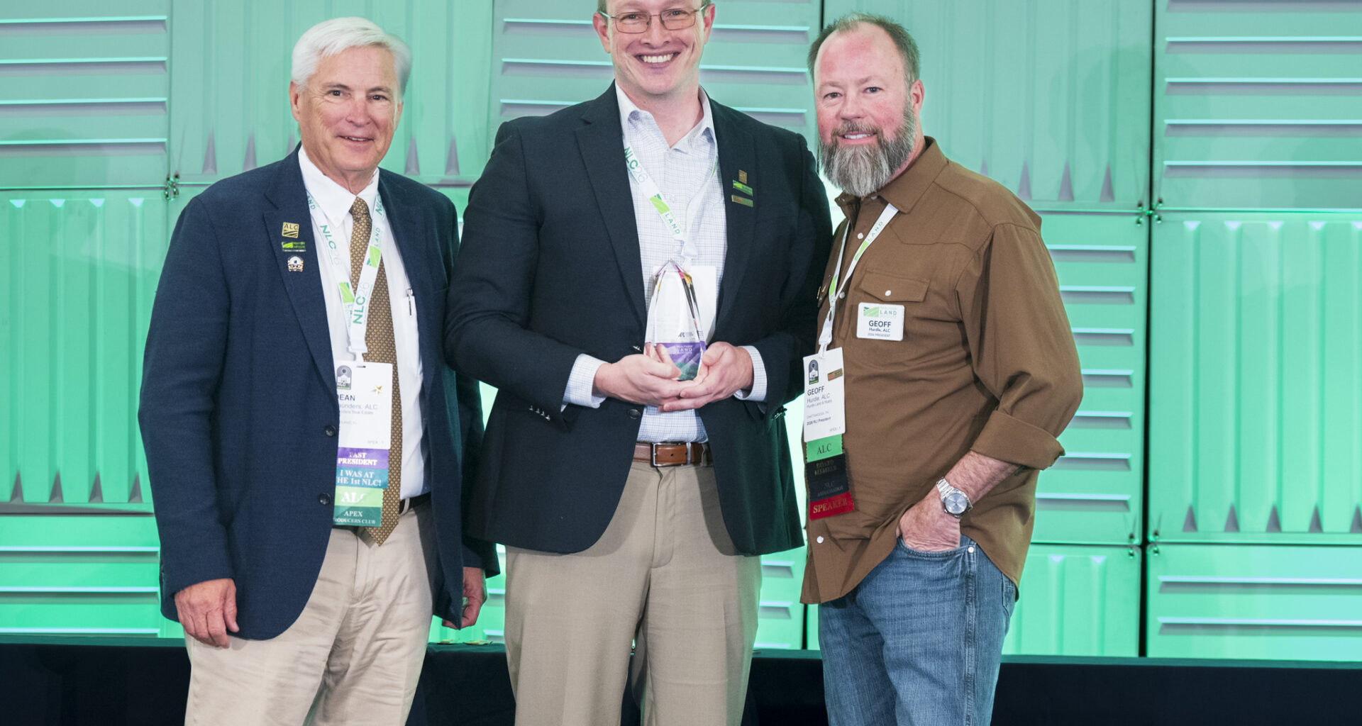Luke Worrell (center) received the Land Realtor of America Award from the Realtors Land Institute. Congratulating him are Dean Saunders (right), the 2024 Land Realtor of America award winner, and Geoff Hurdle, Realtors Land Institute's national president.