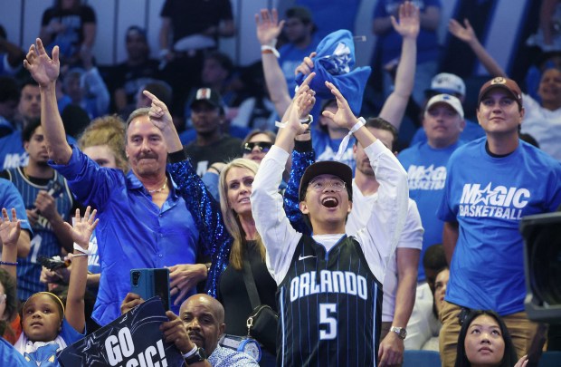 Orlando fans cheer during the Charlotte Hornets at Orlando Magic NBA Play-In game at the Kia Center on Friday, April 17, 2026. Orlando won the game 121-90 to clinch a playoff spot.(Stephen M. Dowell/Orlando Sentinel)