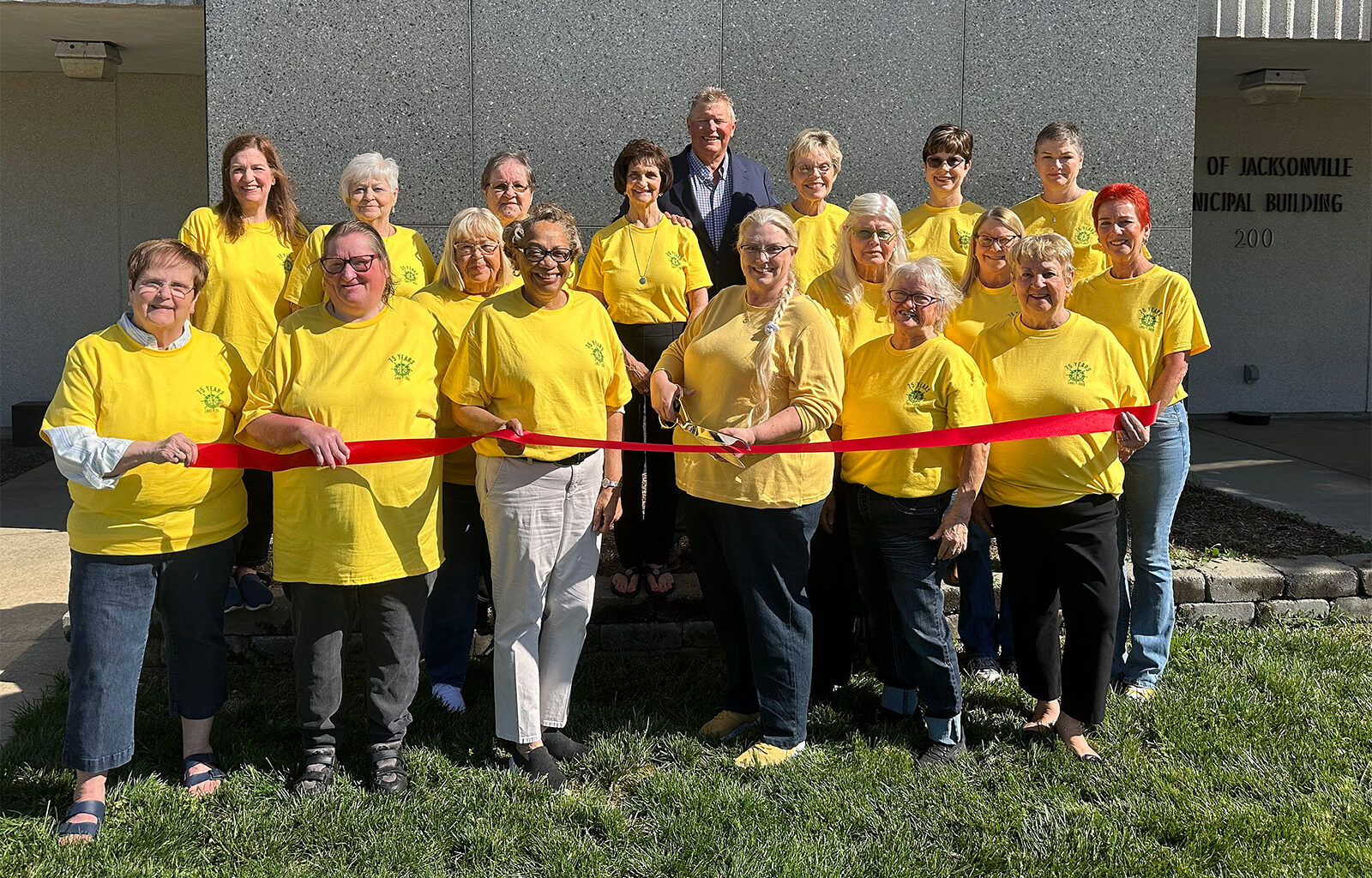 Pilot Club of Jacksonville members attending a ribbon-cutting ceremony with Mayor Andy Ezard included Sue Tapscott (from row, from left), Jody Rees, Alberta Robinson, President Tina Young, Zoellen Smith, Karla Stice; Joanne Chumley (center row, from left), Sue Morrow, Diane Farmer, Sue Thomas; Tammy Mellor (back row, from left), Mary Specht, Carol Wallbaum, Karla Henderson, Ezard, Vickie Austin, Beth Eilers and Angela Salyer.