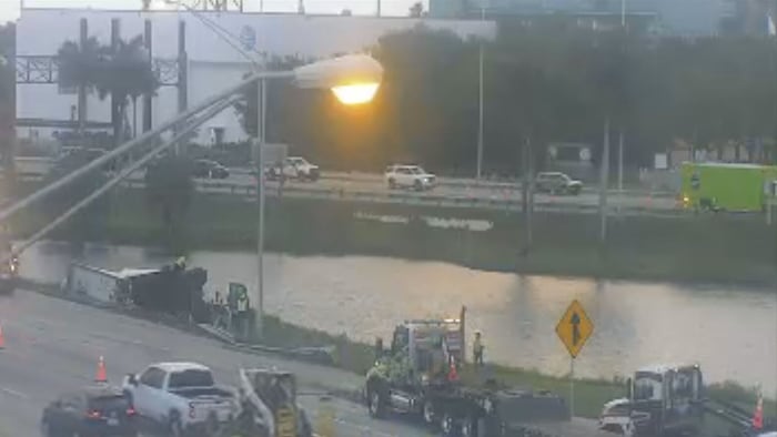 Honda driver cited after semi-tractor trailer rolls over on Turnpike in Broward