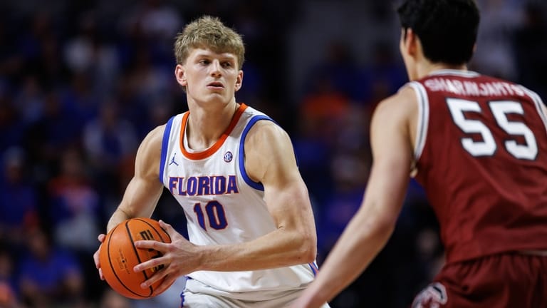 Florida forward Thomas Haugh (10) looks to pass as South...