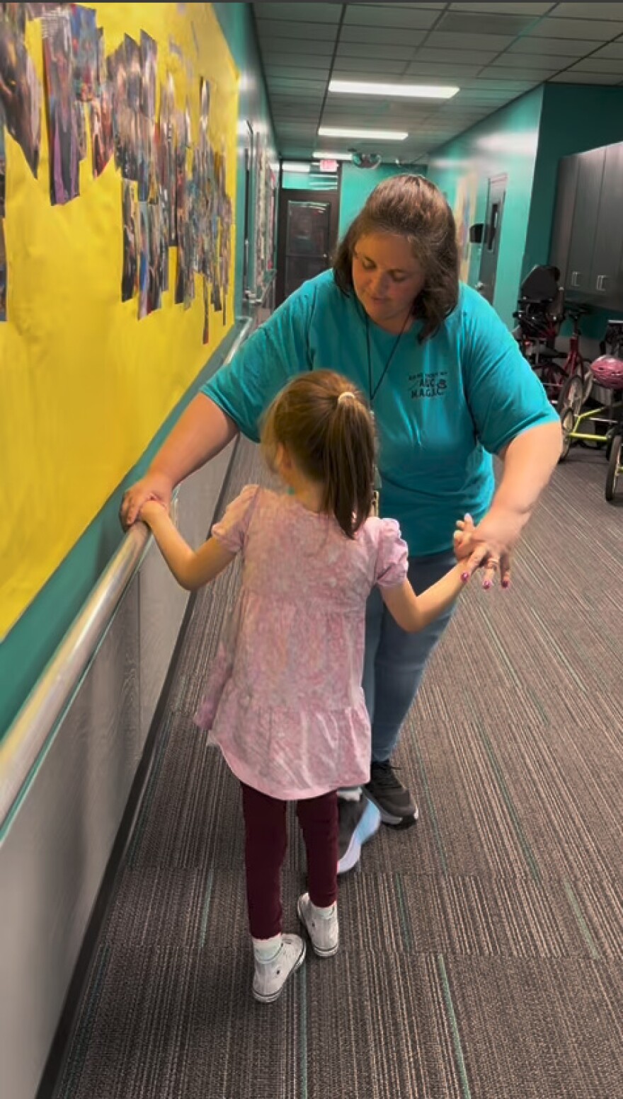 Katie and Will Peterson’s daughter uses handrails along the walls of Buckingham Exceptional Student Center to navigate the school. She is blind. And she is also affected by heat exposure like many of her classmates, so outdoor hallways at Royal Palm School could be problematic.
