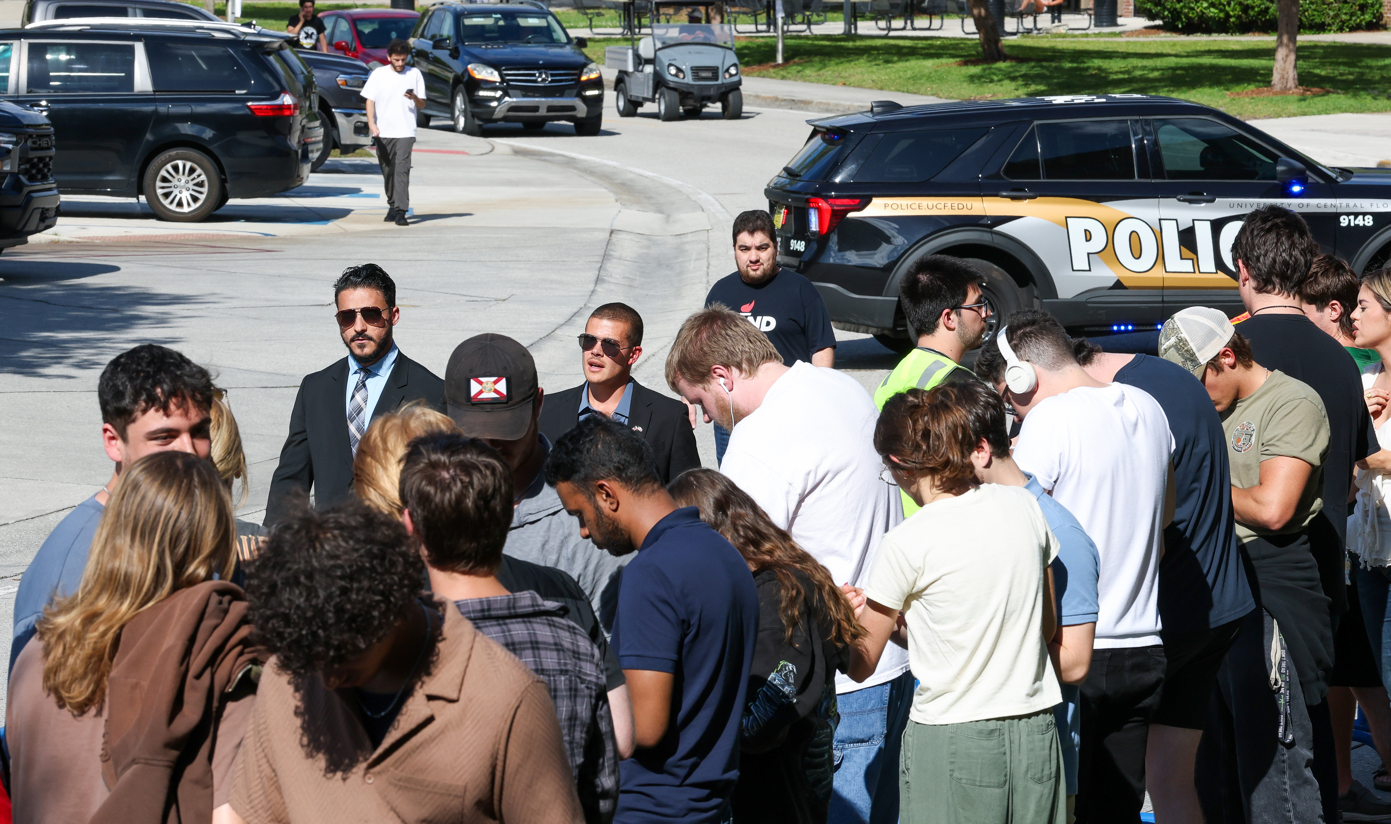 Security personnel for Republican gubernatorial challenger James Fishback survey the...