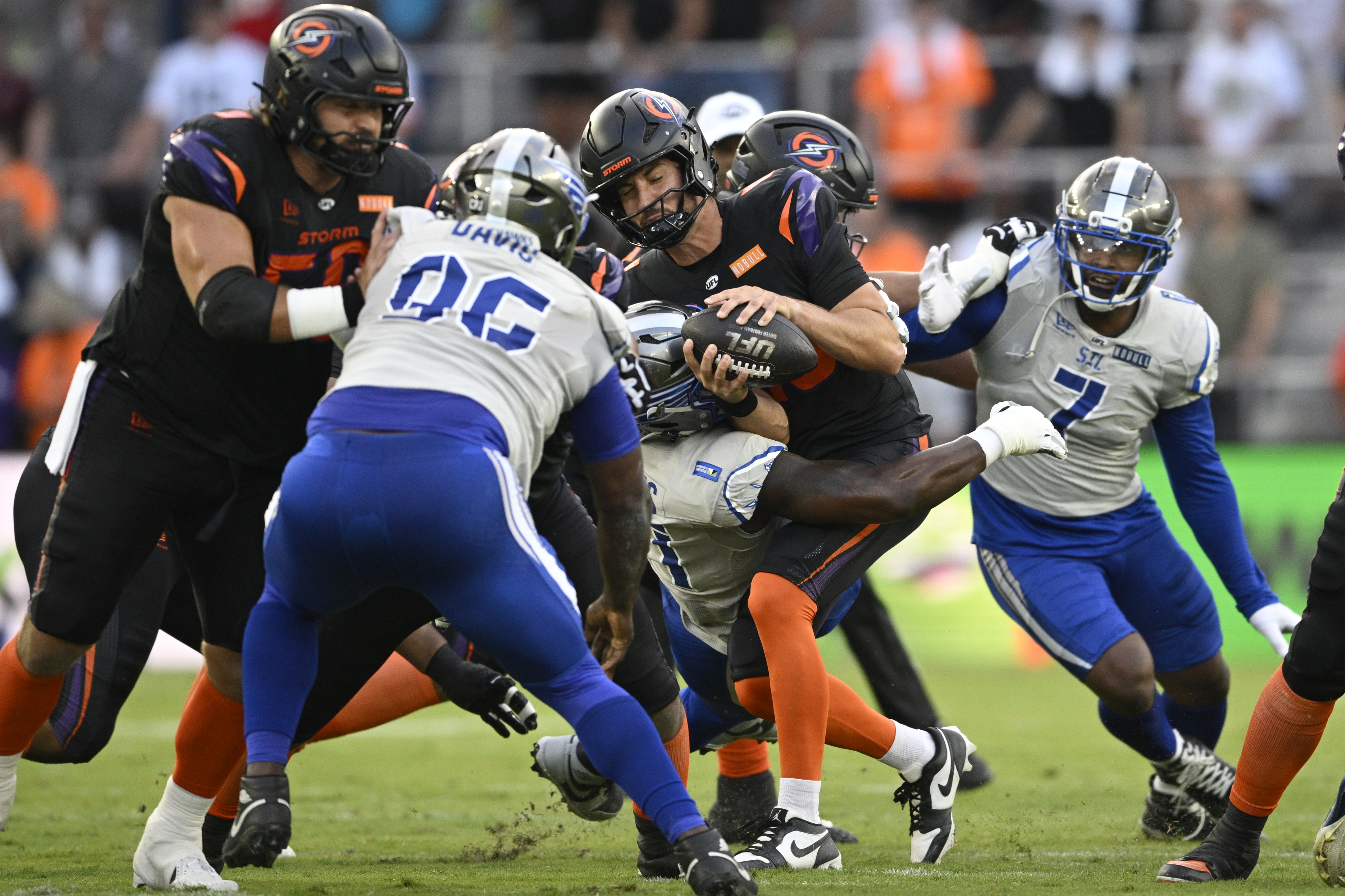 Orlando Storm quarterback Jack Plummer, center, is sacked by St....