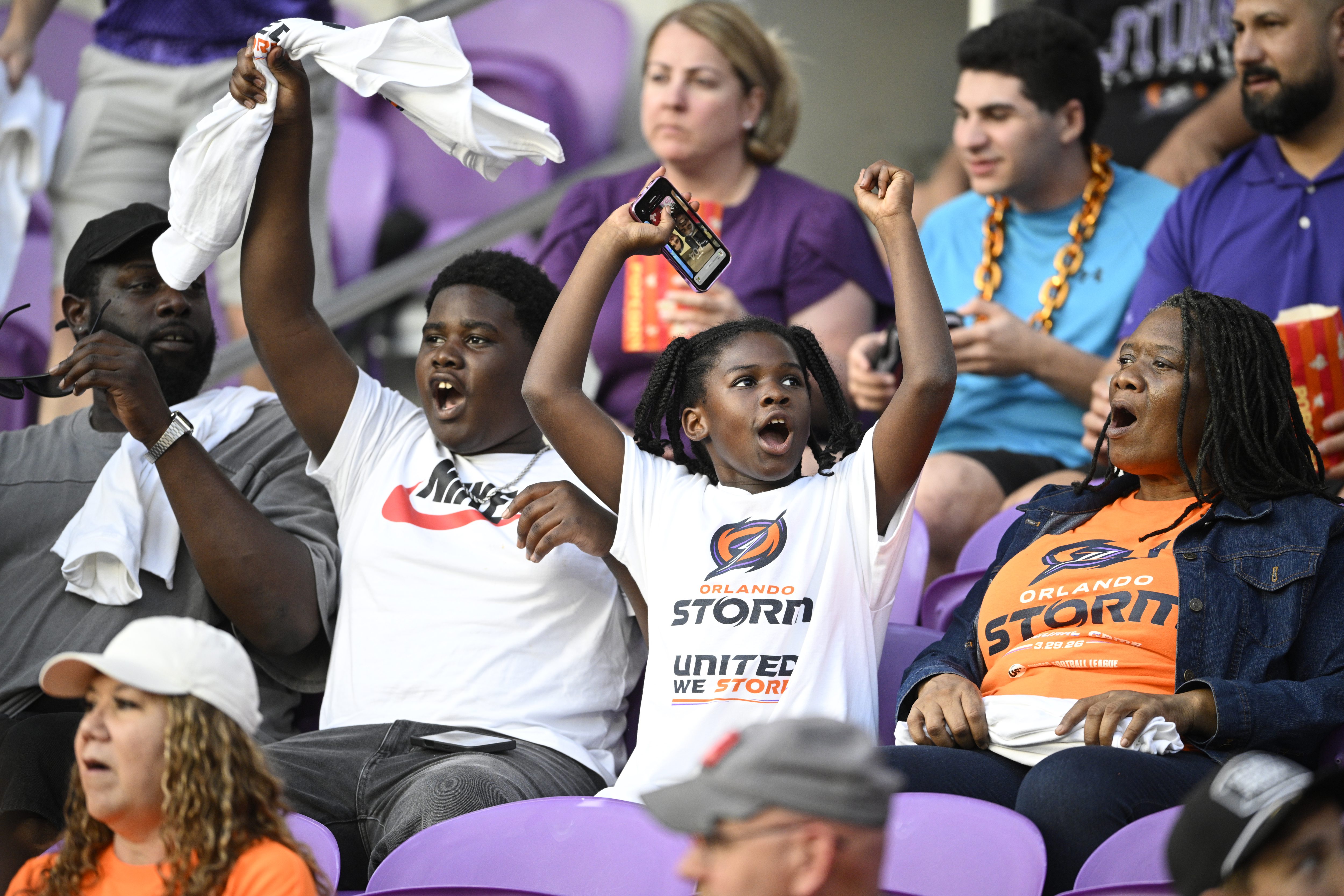 Fans cheer in the stands before a UFL football game...
