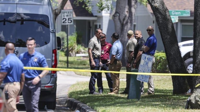 Detectives with the Hillsborough County Sheriff's Office join an investigation...
