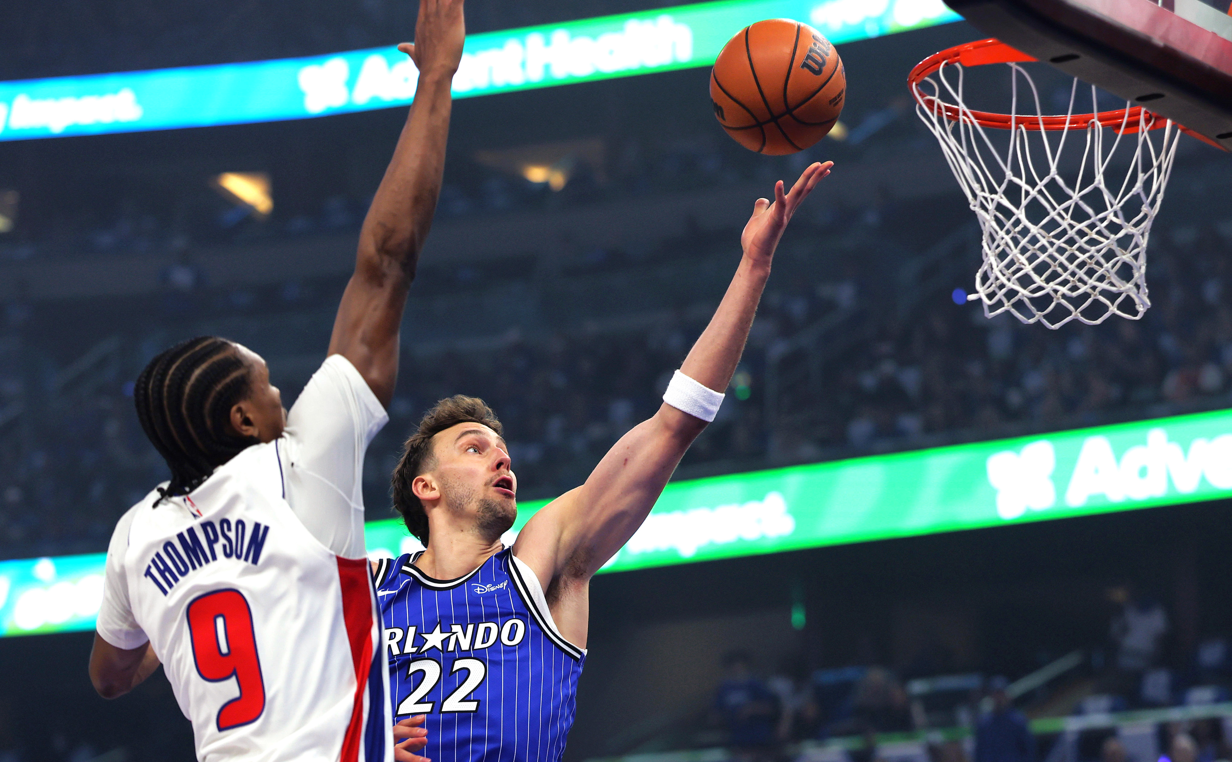 Magic forward Franz Wagner makes a layup around Pistons forward Ausar Thompson during the first half of Game 4 Monday night inside Kia Center. (Joe Burbank/Orlando Sentinel)