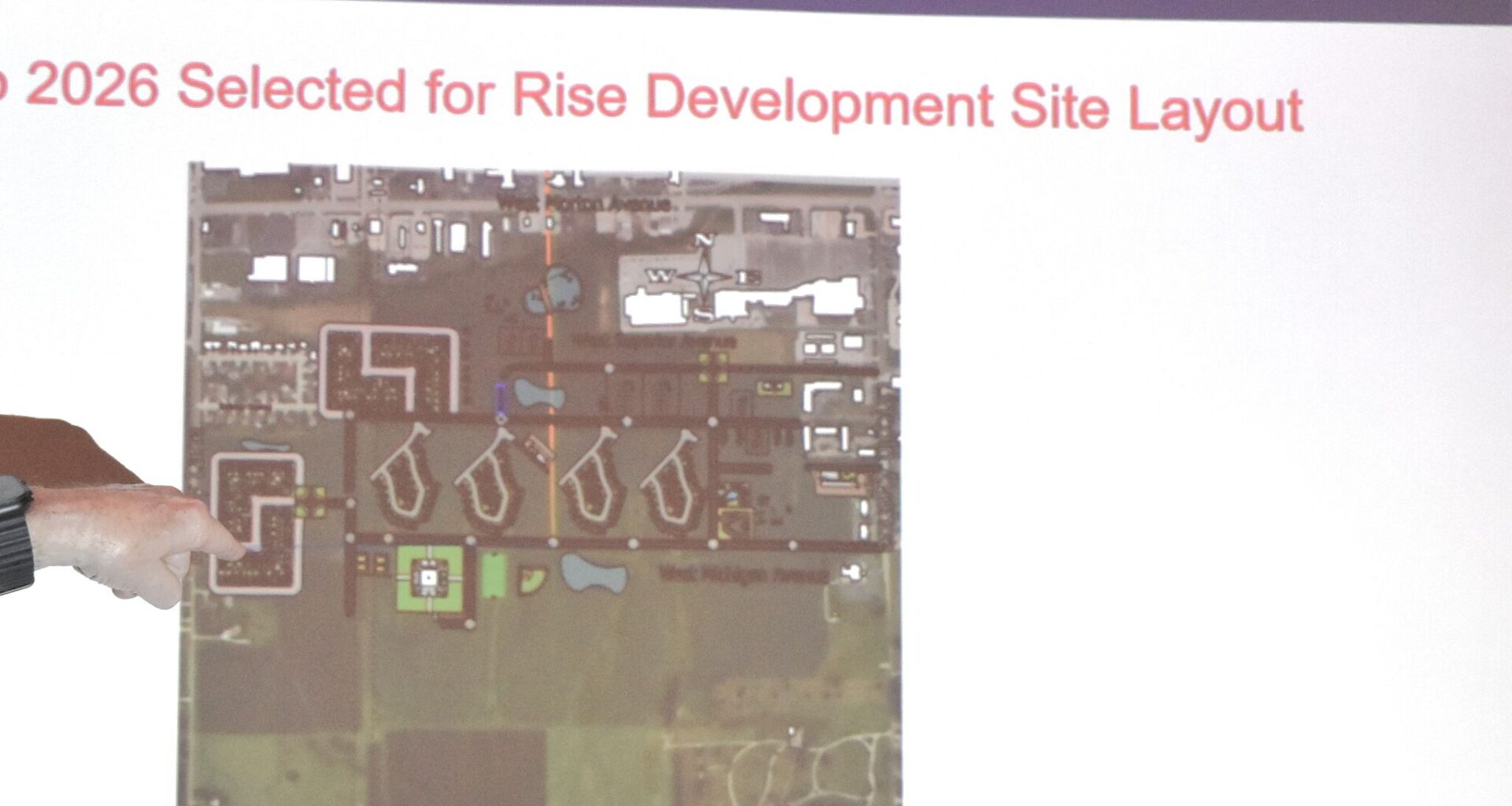 Charles Riggs, an Illinois College associate professor of engineering, presents a potential development plan to City Council.