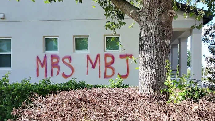 Neighbors alarmed by messages painted across Horizon West home