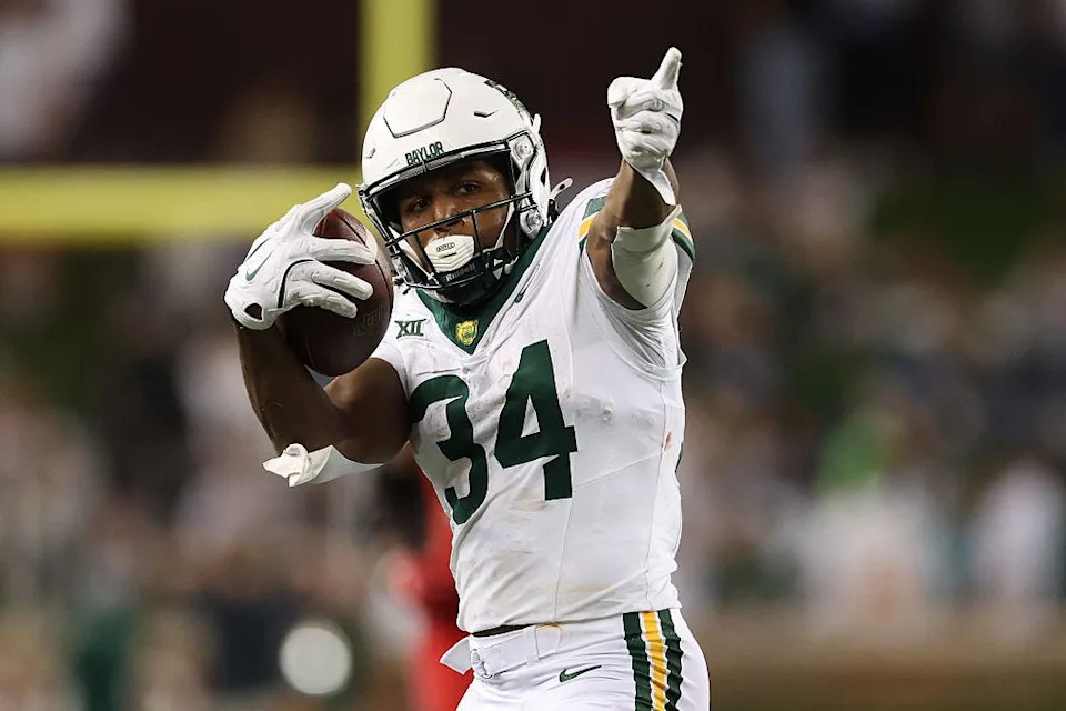 WACO, TEXAS - NOVEMBER 15: Josh Cameron #34 of the Baylor Bears reacts after catching a pass for a first down during the third quarter against the Utah Utes at McLane Stadium on November 15, 2025 in Waco, Texas. (Photo by Sam Hodde/Getty Images)