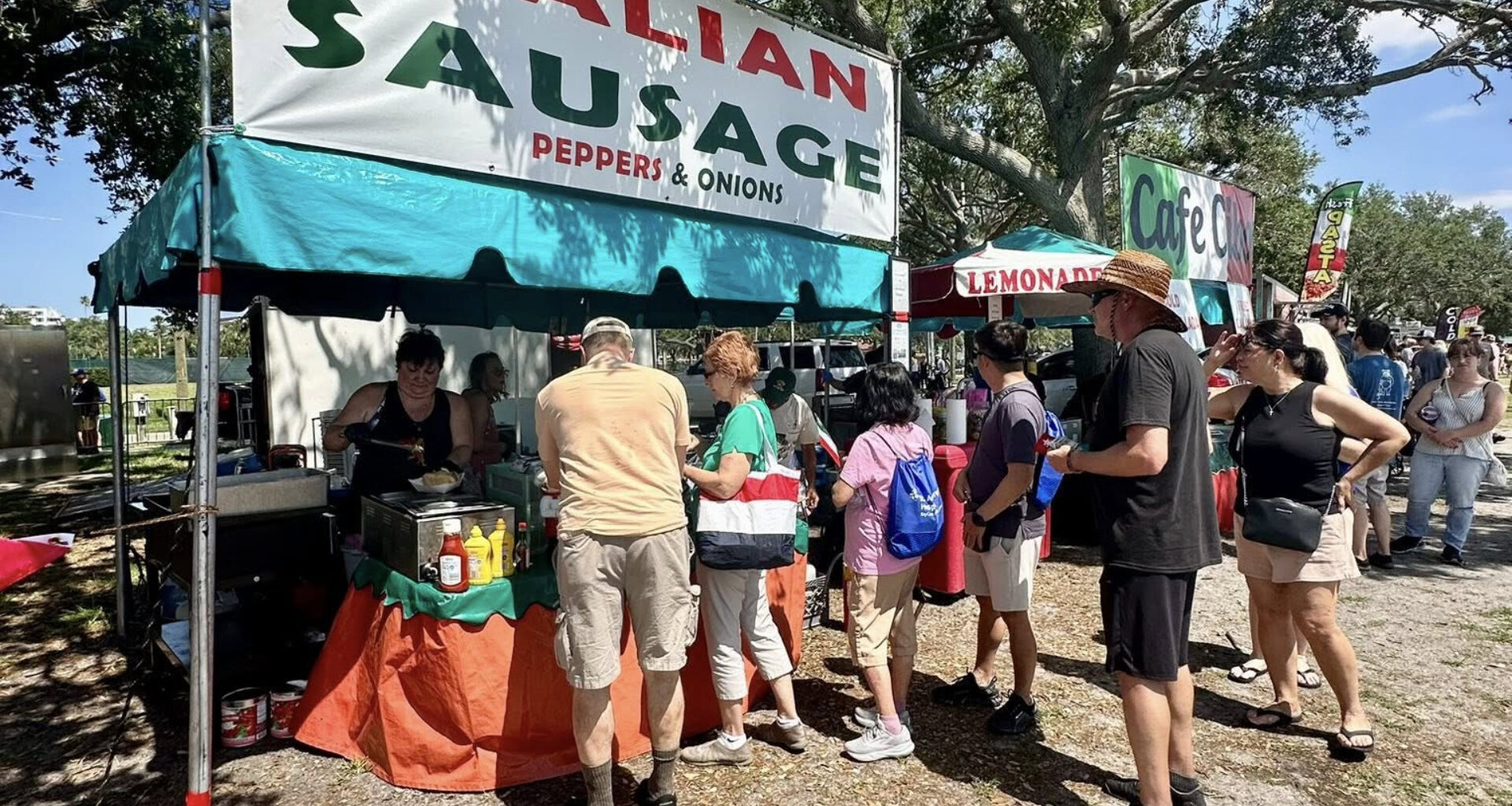 People waiting in line to get food at of park