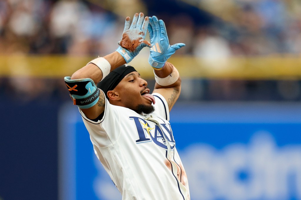 Tampa Bay Rays left fielder Chandler Simpson (14) reacts after hitting a triple against the New York Yankees in the seventh inning at Tropicana Field.