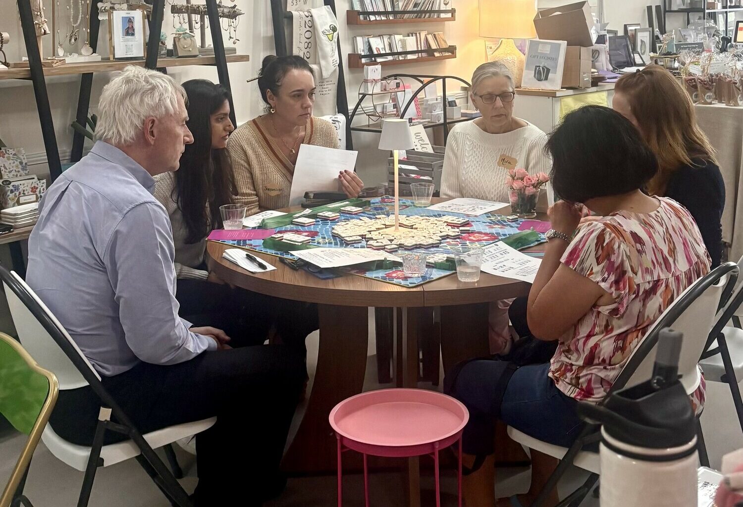 A group playing mahjong at Coastal Elements.