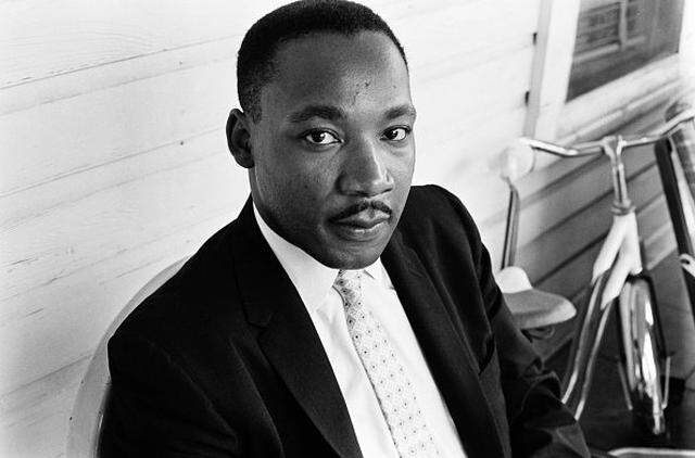 American Baptist minister and civil rights activist Martin Luther King Jr sits outside a property in Montgomery, Alabama, US, May 1961. (Photo by Daily Express/Hulton Archive/Getty Images)