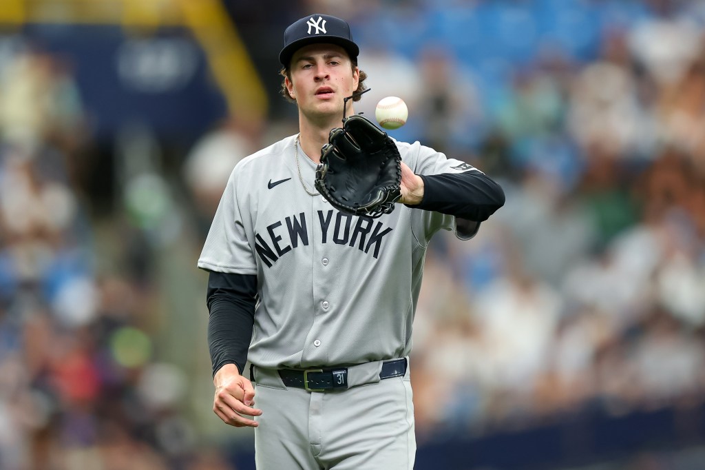  Cam Schlittler #31 of the New York Yankees reacts after giving up a hit against the Tampa Bay Rays during the second inning of a baseball game at Tropicana Field on April 10, 2026 in St. Petersburg, Florida. 