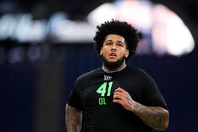 2026 NFL Scouting Combine INDIANAPOLIS, IN - MARCH 01: Kadyn Proctor #OL41 of Alabama runs the 40-yard dash during the 2026 NFL Scouting Combine at Lucas Oil Stadium on March 1, 2026 in Indianapolis, Indiana. (Photo by Cooper Neill/Getty Images)