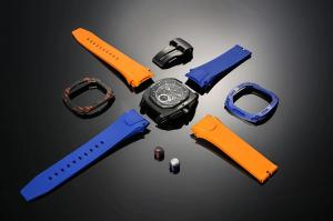 Exploded view of the Tsar Bomba Dark Matter Series watch with interchangeable straps, bezels, and crown components displayed on a reflective black surface.