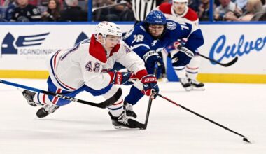 Montréal Canadiens defenseman Lane Hutson (48) is tripped up as Tampa Bay Lightning defenseman Emil Lilleberg (78) defends during the first period of an NHL hockey game, Tuesday, March 31, 2026, in Tampa, Fla. (AP Photo/Jason Behnken)