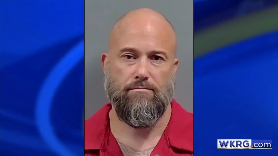 Grant Bieber mugshot, placed on a blue background with the WKRG.com logo