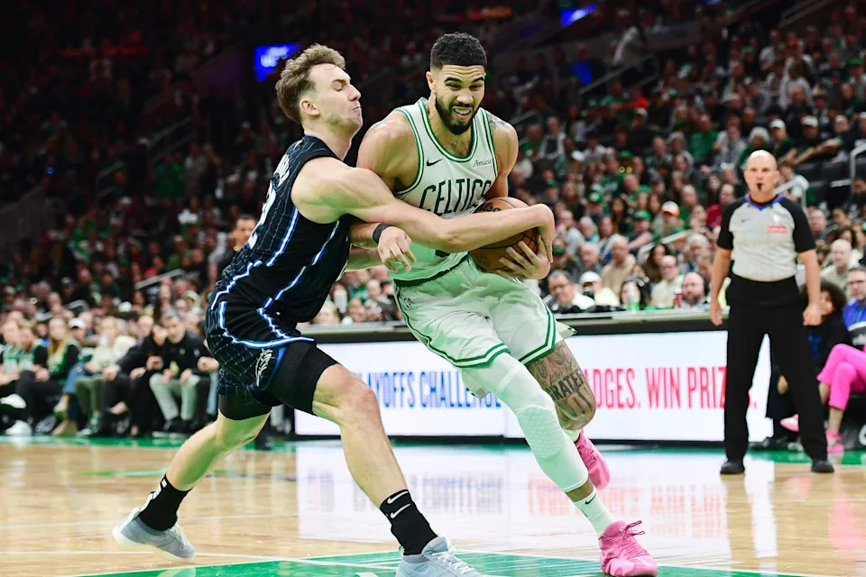 Apr 20, 2025; Boston, Massachusetts, USA; Orlando Magic forward Franz Wagner (22) tries to steal the ball from Boston Celtics forward Jayson Tatum (0) during the second half at TD Garden. Mandatory Credit: Bob DeChiara-Imagn Images