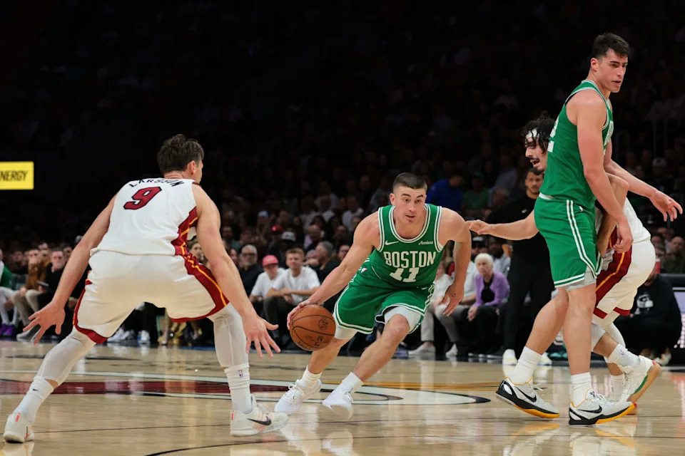 Apr 1, 2026; Miami, Florida, USA; Boston Celtics guard Payton Pritchard (11) drives to the basket against Miami Heat guard Pelle Larsson (9) during the third quarter at Kaseya Center. Mandatory Credit: Sam Navarro-Imagn Images