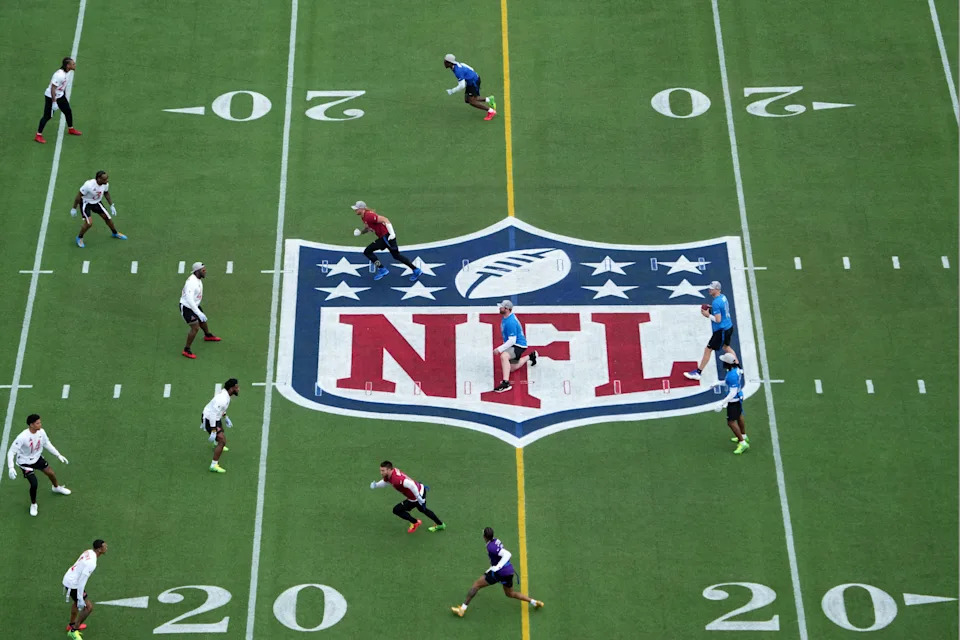 Feb 2, 2025; Orlando, FL, USA; A general overall view as NFC quarterback Jared Goff of the Detroit Lions (16) throws the ball on the NFL shield logo at midfield during the 2025 Pro Bowl Games at Camping World Stadium. Mandatory Credit: Kirby Lee-Imagn Images