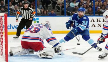 Tampa Bay Lightning left wing Brandon Hagel (38) takes a shot on New York Rangers goaltender Dylan Garand (33) during the second period of an NHL hockey game Wednesday, April 15, 2026, in Tampa, Fla. (AP Photo/Chris O'Meara)