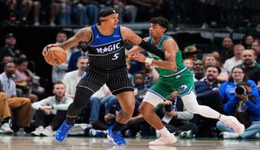 Orlando Magic forward Paolo Banchero (5) works to the basket against Dallas Mavericks' Max Christie, right, in the first half of an NBA basketball game Friday, April 3, 2026, in Dallas. (AP Photo/Tony Gutierrez)