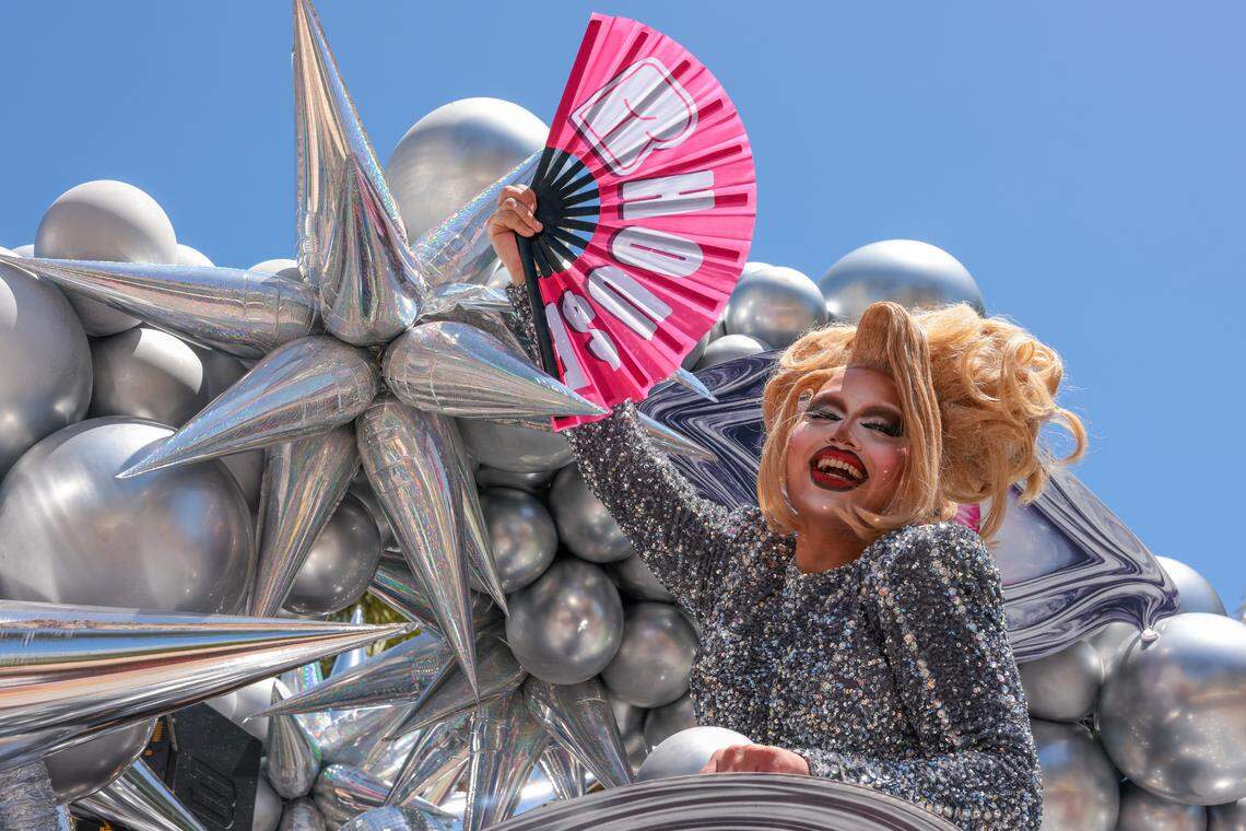 A drag performer reacts from a parade float on Ocean Drive during the 18th annual pride parade in Miami Beach, Florida, Sunday, April 12, 2026.