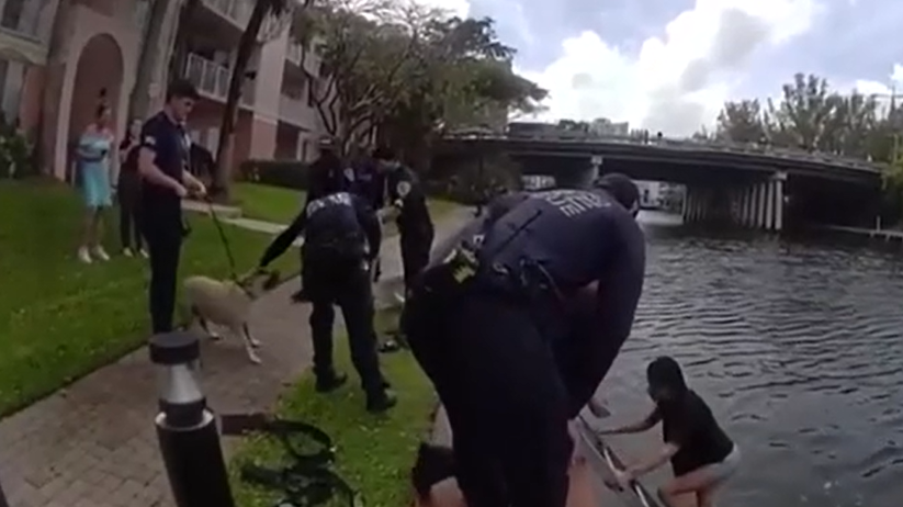 Police rescue Florida woman, dog from canal