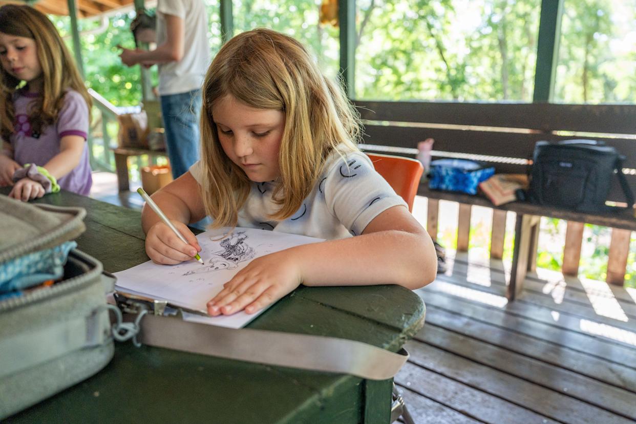 A student at Grassroots School works on a drawing Wednesday, April 15, 2026.