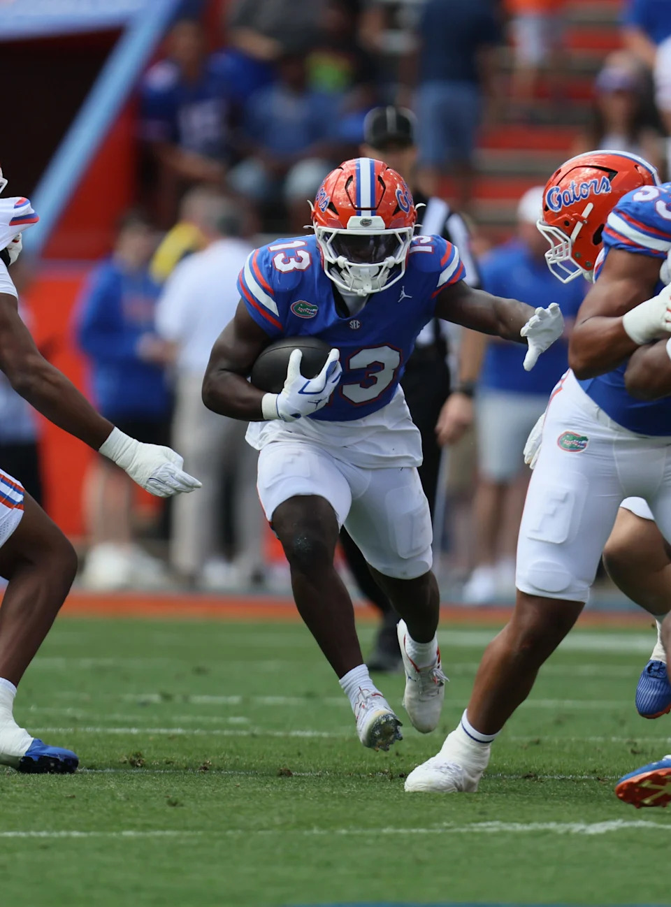 Florida running back Jadan Baugh (13) runs during the second half of the Orange and Blue game at Steve Spurrier Field at Ben Hill Griffin Stadium in Gainesville, FL on Saturday, April 11, 2026. [Alan Youngblood/Gainesville Sun]