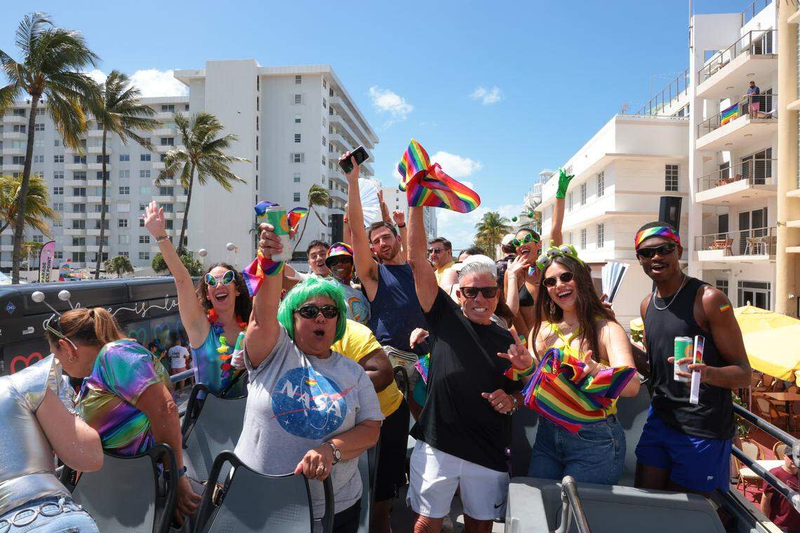 People on a double-decker bus celebrate during the 18th annual Miami Beach Pride parade in Miami Beach, Florida, Sunday, April 12, 2026.