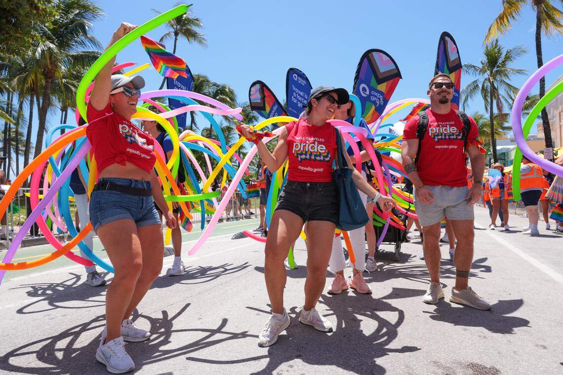 People dance on Ocean Drive during the 18th annual pride parade in Miami Beach, Florida, Sunday, April 12, 2026.