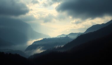 A vast, atmospheric landscape painting depicting the silhouette of a small town nestled within a dramatic, fog-shrouded valley, conveying the overwhelming scale and power of the natural world.