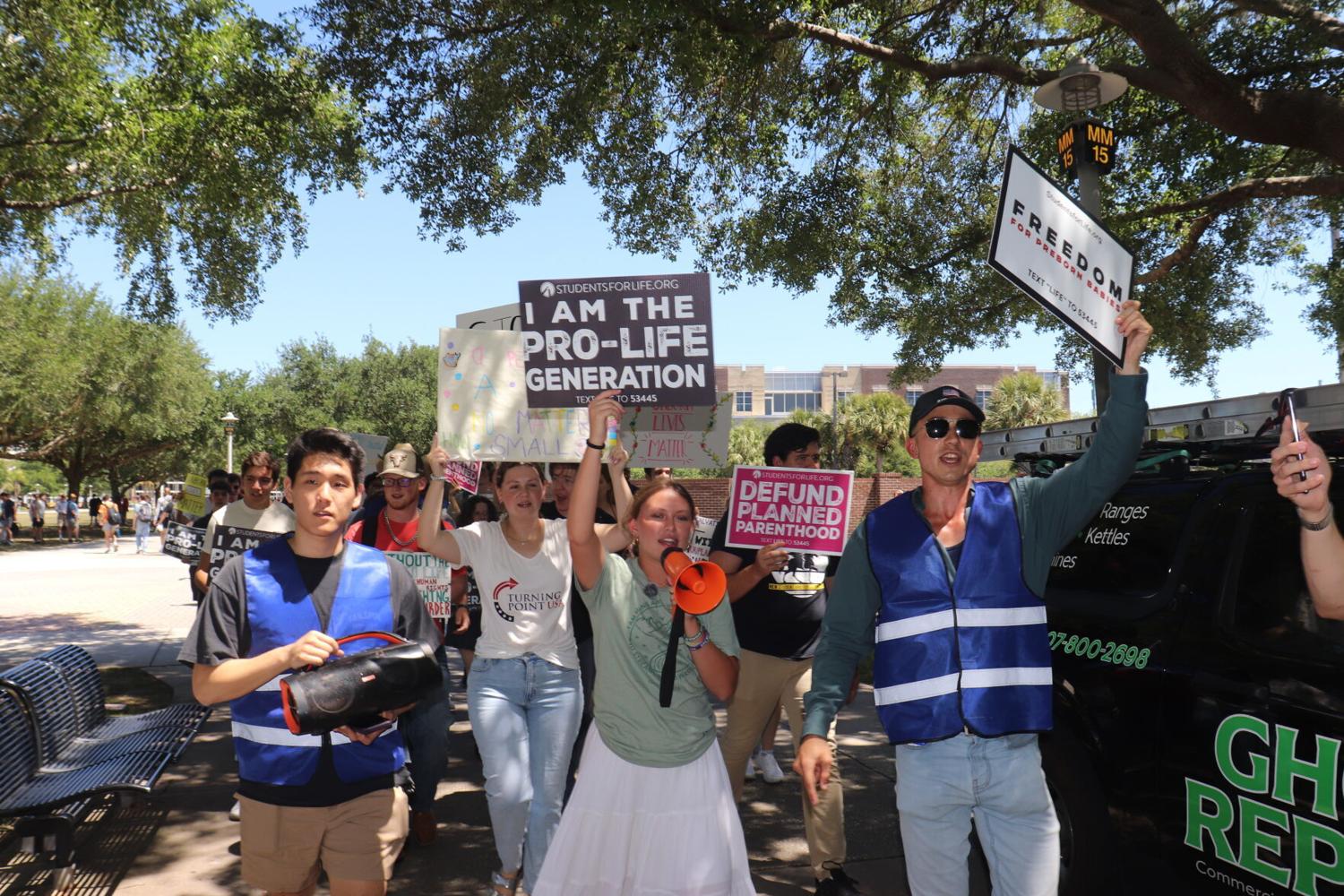 Anti-abortion advocates march around campus, encouraging end to abortion | Life