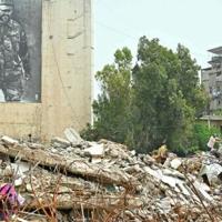A resident inspects the rubble of destroyed buildings on his return to the southern Lebanese city of Nabatieh | News