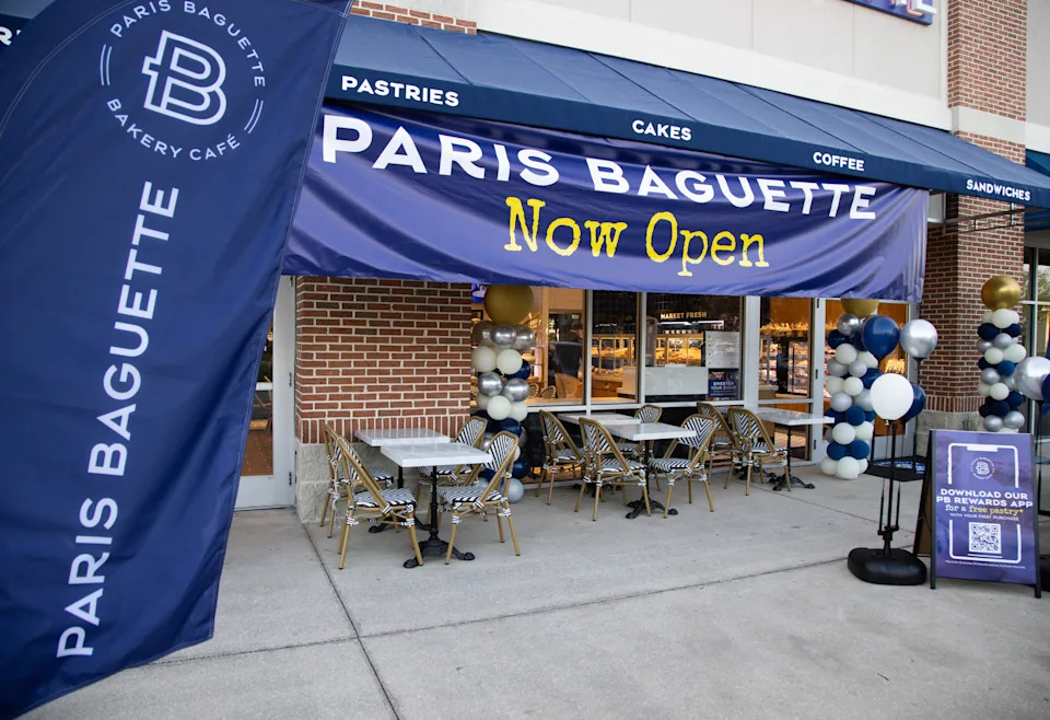 Signage celebrates the opening of  Paris Baguette at the St. Johns Town Center. The South Korean-founded chain headquartered in New Jersey is known for freshly made pastries, baguette sandwiches, Mochi donuts, cakes, tarts, breads and other offerings.