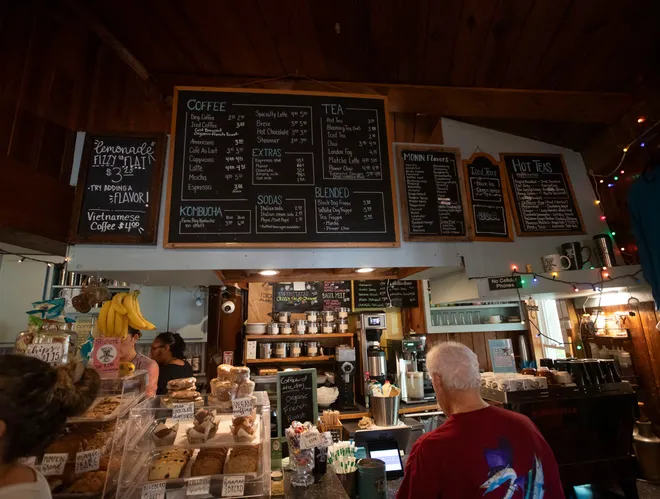 The menu boards and front counter at Tallahassee's longest standing, independently owned coffee shop, the Black Dog Cafe, in the back of the American Legion hall at Lake Ella.