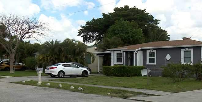 Police say a man died Saturday night in the 300 block of West 27th Street after a car fell on him while he was changing a tire.