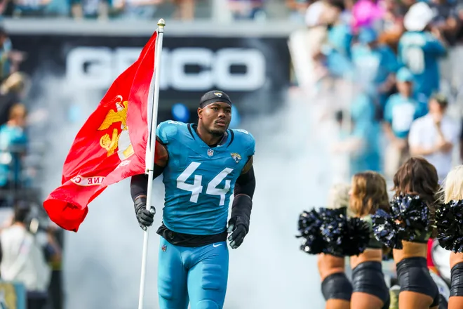Nov 16, 2025; Jacksonville, Florida, USA; Jacksonville Jaguars defensive end Travon Walker (44) participates in pregame player introductions against the Los Angeles Chargers at EverBank Stadium. Mandatory Credit: Nathan Ray Seebeck-Imagn Images